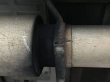 Exhaust leak pre-muffler?  There is soot around the front of the muffler.