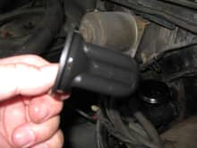 The cap has a breather hole above this rubber device and the inside of the device was full of liquid, assumed brake fluid and water. The true reservoir appears to be between this device and the outer walls of the reservoir. Maybe this rubber is a spacer/filler to reduce the amount of fluid needed.