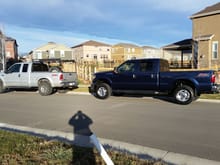 Old Truck (2003 F-250) parked in front of New Truck (2015 F-250)