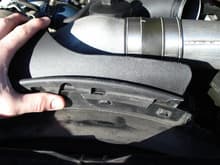 I found this part to be ANNOYING to remove, simply because I snapped off a corner piece (as you can see in the picture) - however, if you are replacing your serpentine belt and don't plan on removing the outer fan shroud that requires the removal of the fan/clutch assembly, I found it necessary to remove this piece.