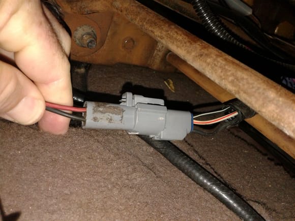 I had to move the wires in my fingers over to different pin holes to match the power and ground for the '04 seat. Just a fused ground and a hot on the truck side. The harness connector for the '04 power seat is on the left.