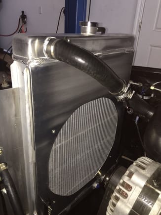Here's a shroud I built from 1/8" aluminum sheet.  Welded to a Speedway universal radiator.  Also built the mount wings.
