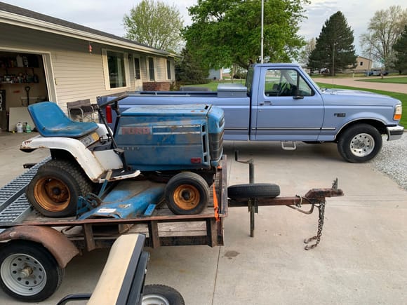 Ford and a Ford!  A friends dad had passed away the year prior and he was a hoarder.  3 auctions, 3 locations, 2-3 rings each auction.  Close to 100 cars hauled off for junk, 400 ish sold at auction, 100+ tractors...  First auction I brought home this gem for I think $50 or something cheap.  Beieve it or not that rear tire holds air, somehow.  The mower runs like a champ after some tinkering.