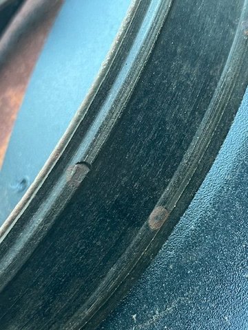 The corresponding brake shoe worn past the rivets.