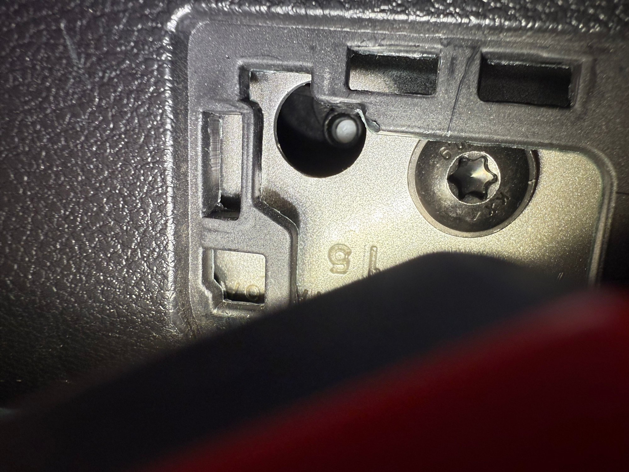 Press the white pin in with a curved pick