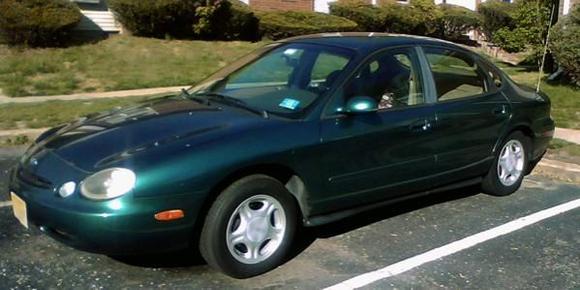 My '96 Taurus GL - Finally got a pic of it...Nothing fancy standard entry-level stock Taurus...3.0 Vulcan w AX4N tranny...Just turned over 80K...Bought it with 76.6K almost a year ago (medical limitations, so I don't drive it a whole lot)...Replaced battery, coolant reservior, sway bar linkages, new brakes and tires, tranny fluid change when I bought it (was not done @ 60K), Tune-up with new plugs and wires, radiator flush within a few days of this writing...Needs a few additional things that will be addressed as fund availability comes into play, and eventually will have a small ding in the RR door bumped out, and have it repainted the same color...Runs good...