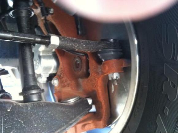 Inside front wheel, driver's side