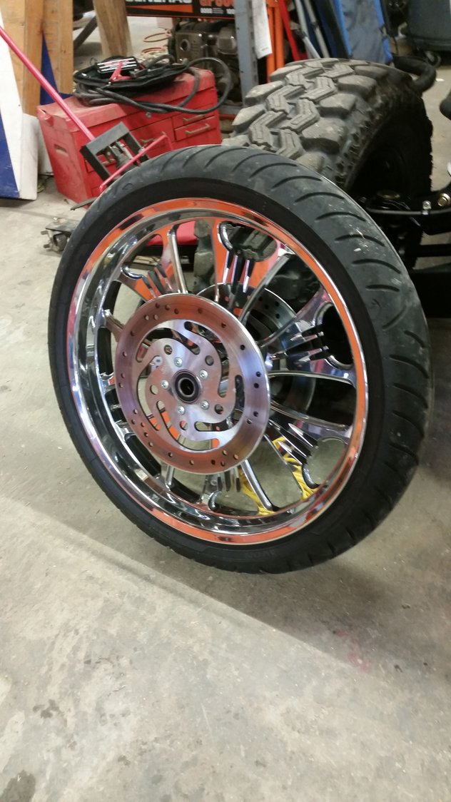 21" Performance Machine wheel chrome with Avon venom tire Harley