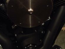 I was originally going to do rivets to hold on the medallion but ended up drilling and tapping the holes and using button head screws.  The five star pattern kind of matches the five bolt pattern on the timing cover.