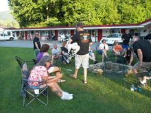 Sitting in the grassy area telling lies.