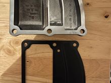 This is the stock cover and stock gasket, the crankcase portion (on the right) is completely sealed off with the stock cover/gasket.  The Trask cover and new gasket opens this area up with a one way reed valve to allow it to vent. 