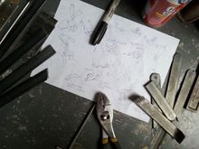 Started off with some rough sketches, then cut the metals, bend then weld and grind.