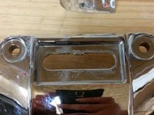 The little tin plate covering the hole is just glued on and pops right off.