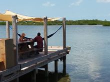 A view from the pool area of the dock and the lagoon.