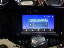 Android Auto's main screen: top card is the music source, middle is weather and the bottom (mostly hidden) card shows the last call made.