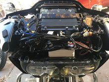 I cut off the tabs that hold the wiring on the top of the headlight and it slid right in there.  I used the Velcro that came with the amp  to secure it to the headlight.