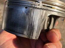 This is the rear piston.  Scoring is basically right above the piston jets.  Front piston looks virtually the same.