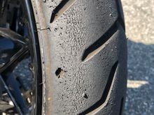 Stock front tire was taking everything I threw at it. Stuck just fine. 