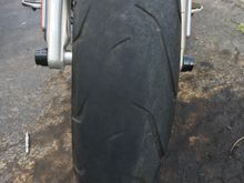 Looking at the front of the bike, tread is worn more on the left side than the right. What causes this ? Tires have a little over 8100m on them. The back needs replaced too, but is worn right down the middle