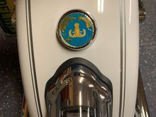 a motodog69 challenge coin holder covers the three holes just right and let me add some personalized stuff to the sled.