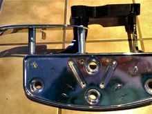 Extended the heel guard with a couple of 1" spacers.  Couldn't find stainless, so I spun the plated ones I got on the lathe and polished and shot them with some clear.  5/16" bolt front, 1/4" back.  You can see the flat head bolt for the back mounting block.  You can see the outer bracket attached.
