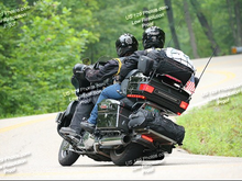 As long as you don't go crazy there's a nice 10" gap between the top of the bag and the bottom of the tourpak to see the plate.