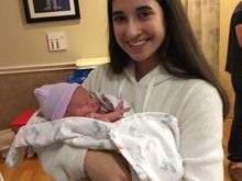 With her big sister.