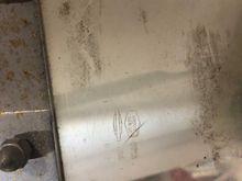 Right hand bottom corner, writing faces in towards rider. 