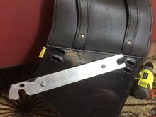 Attached to the bag with stainless steel screws and nuts and plastic spaces.