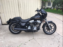 Here its is mocked up before the complete teardown.  100% LED lighting; Alloy Art strut mount r signals, joker 39mm mount f signals, 5 3/4" daymaker style headlight, custom dynamics tail light, bad lands load equalizer.  RSD seat, Ness side covers, stash tray and fairing, progressive 412 shocks, dyna 2000 programmable ign, BUB 2-1 exhaust and stage 3 motor rebuild.  Will be 100% blacked out, engine is done. Waiting on powdercoat for wheels, front end, primary covers and Tranny covers.