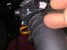 Okay, so get this. Pressing the trigger switch does nothing. But, if I lift it up and press in in this rubber piece my screw driver is touching in the photo (obviously the switch that the trigger is supposed to be engaging) the trip ometer cycles through like it supposed to. Is is possible the bottom of the trigger button got broken off when the bars were replaced or something?!?