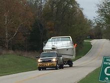 A pic a friend took when I hauled the 34 Baja home last fall. 12' beam, needed permit and signs to haul