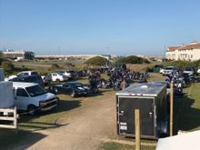 Longboards rear parking, sweet 1st gen Camaro, and you can see ocean through the break in the fence
