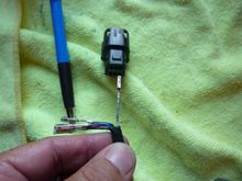 It really is as easy as orientating the pins correctly and pushing them into the hole until you hear a CLICK.