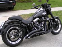 Vans &amp; Hines big radius black exaust
Stage 1 Super Tuner
Screaming Eagle air filter
Oil tank (vivid black)
Transmission cover (vivid black)
Timer Cover (vivid black)
Fork Sliders (vivid black)
Upper Fork Slider (vivid black)
