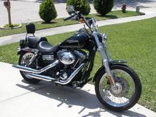 Added passenger seat/pegs, sissy bar, 2" tank lift, Hwy pegs and chrome battery trim band.