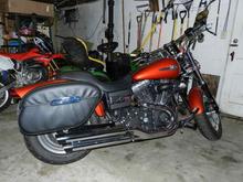 Done for now: Rush 2" Slip Ons, Heavy Breather Air Intake, TK3 Fuel Injection Modulator, Diamond Cut Series Controls, Hard Locking Bags, Gremlin Bell (Thanks Rob!)  Not in photo Medallion Backrest detach frame with large cushion, Sundowner seat, accessory plug, Skully (my skeleton rider).