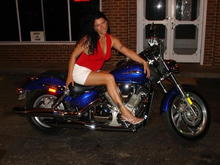 My chick posing on some guy's bike, before I bought my WG.  I got permission...