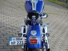License plate relocation and two up LePera custom leather seat and Haulin' Ass sissy bar for my lovely ladies comfort.  I don't ride in this combo very often, but when she wants to ride it's only a 5 minute operation to convert to 2Up.