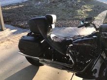 The backrest pictured has been replaced with the H-D airflow accessory