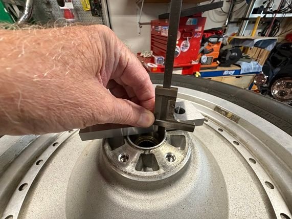 Measure from top surface of upper bar to the top surface of the lower parallel bar.
