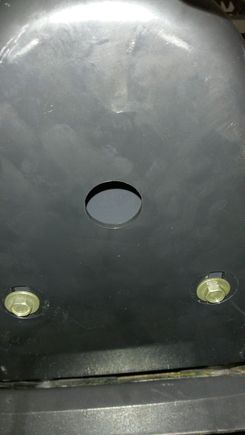 Place a flat washer (9) on one of the pan head machine screws (8) from the kit. Position the spoiler to the front of the frame. Insert the screw through the large hole in
the bottom of the spoiler and thread it into the upper front spoiler bracket, but do not fully tighten at this time.