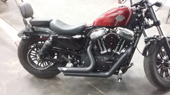 Finally got my stage 1 kit put on last night. Vance and Hines short shots, and 587 outlaw A/C, and flash tuner made its way to my scooter last night around 10:00. Also put smoke brake cover and turn signal covers on. I then removed the lower belt guard. I have some thunder torque 158w's, but i wanted to try it out before i remove the baffles and insert those.  Ill get a better pic up later. It was late.