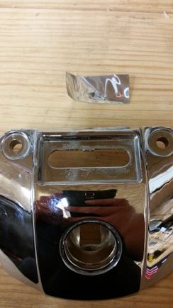 The little tin plate covering the hole is just glued on and pops right off.