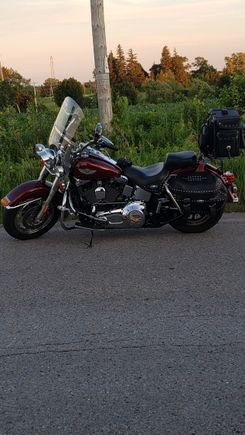 Smoke break during an evening ride admiring my 03 heritage softail classic