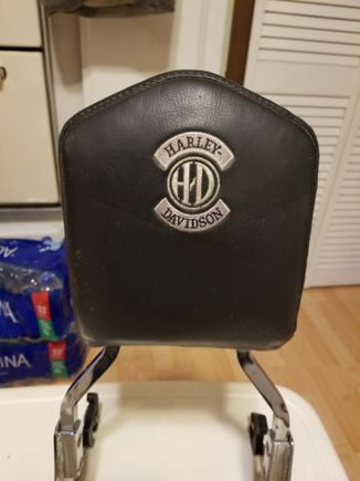 There is a mark on the sissy bar on the lower left just above the side plate. This is not perfect, but on the bike it looks good.