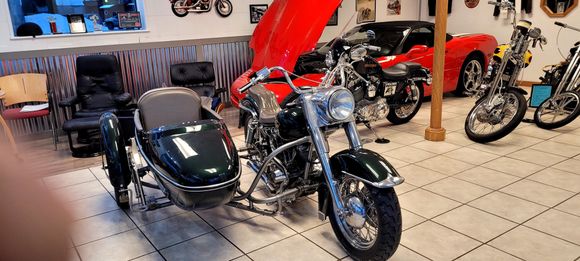 I just bought this 1973 FLH with a HD sidecar, the first for me.  The third wheel has been replaced with a front wheel from a Sportster to support a disc brake from Performance Machine. It matches the disc brake setup on the bike. I've yet to see a similar swap...