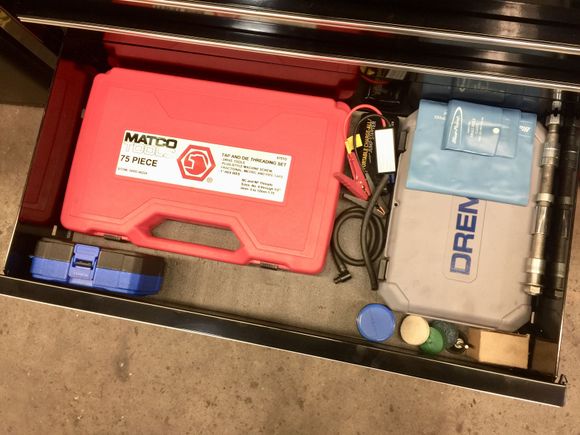 Matco tap and die set along with a dremel. I have an extra axle too that way when bikes with timken bearings come in I can take the wheel off put it on my axle and vise and check end play. Easier when it’s off the bike and you get the same results if you do it like this as long as you follow procedure.