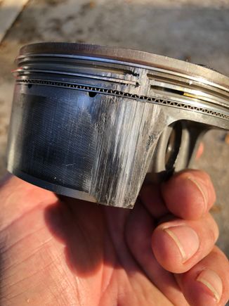 This is the rear piston.  Scoring is basically right above the piston jets.  Front piston looks virtually the same.