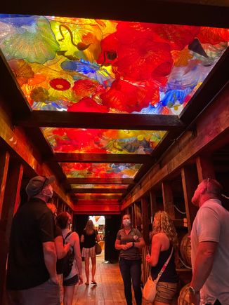 Assortment of blown-glass sculptures fill the ceiling in this barn.